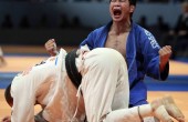 Tsagaanbaatar Hashbaatar of Mongolia celebrates after winning his match against Alim Gadanov of Russia in the under 66 kg men's semifinals_