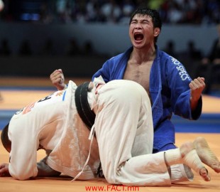 Tsagaanbaatar Hashbaatar of Mongolia celebrates after winning his match against Alim Gadanov of Russia in the under 66 kg men's semifinals_