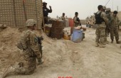 U.S. soldiers keep watch at the entrance of a U.S. base in Panjwai district Kandahar