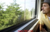 Man Looking Out Train Window