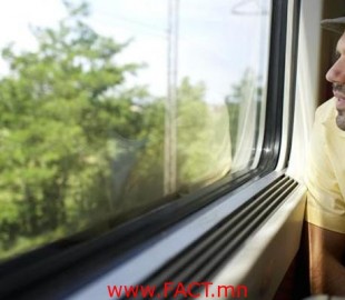 Man Looking Out Train Window