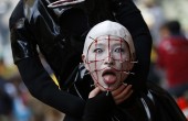 A participant in costume poses before a Halloween parade in Kawasaki