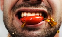 getty_rm_photo_of_man_biting_tomato