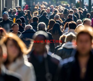 Anonymous crowd of people walking on city street