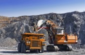 Loading the gold ore into heavy dump truck at the opencast mining