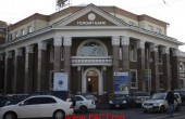 Cars drive past a branch of Golomt Bank in Ulan Bator