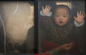 A baby looks through the window of a vehicle stranded on a highway between Beijing and Hebei province, China, that is closed due to smog on an extremely polluted day