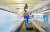 1200-woman-walking-at-airport-1024x613