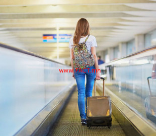 1200-woman-walking-at-airport-1024x613